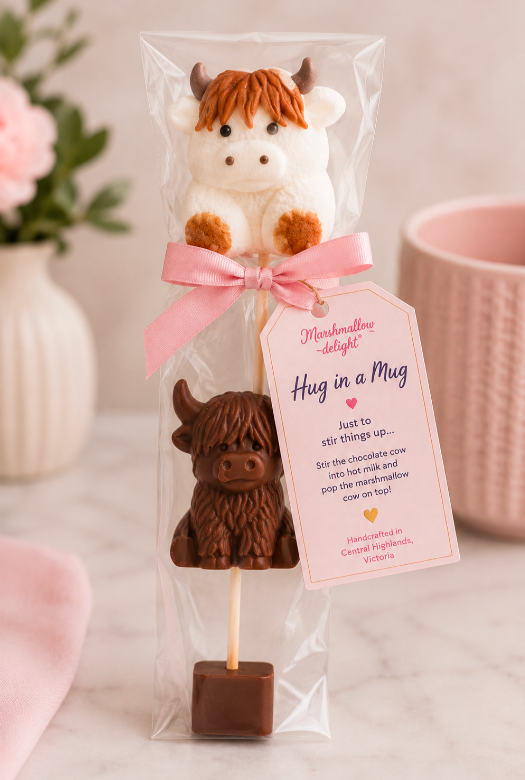 Hug in a Mug Highland cow hot chocolate stirrer with a marshmallow cow and chocolate cow on a stick